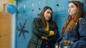 Two students talking near lockers.