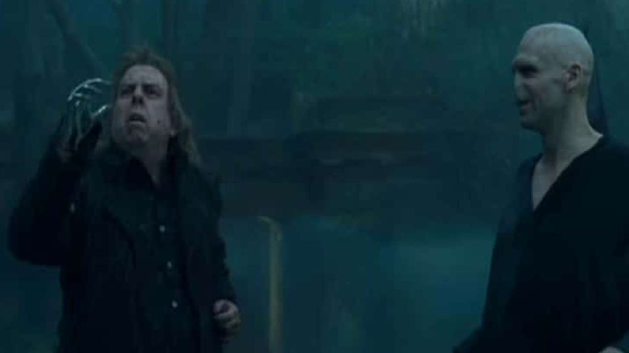 Dark wizard confronts fearful follower.