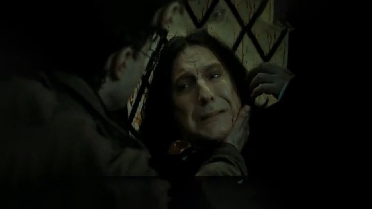 Severus Snape in a moment of vulnerability, as Harry Potter grips his throat. Snape is shown with a pained expression, revealing the emotional complexity of his character in a key scene from the Harry Potter series.