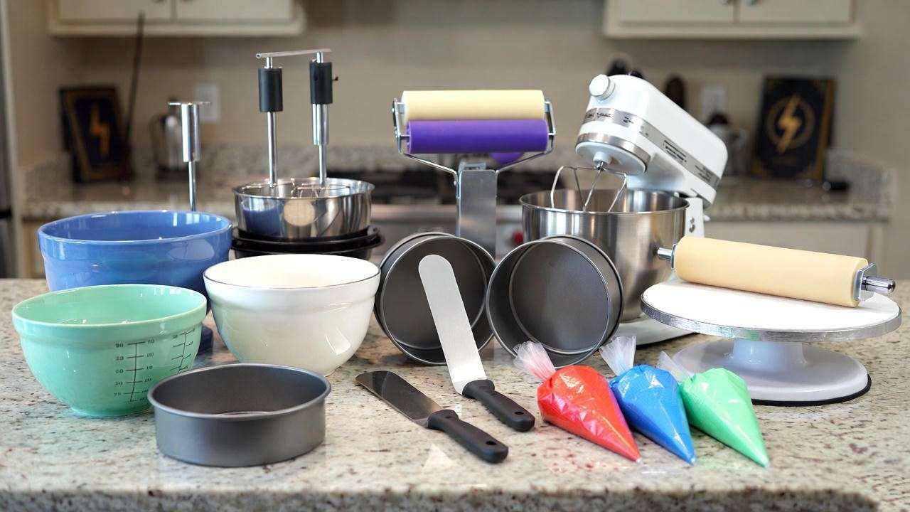 Baking tools for Harry Potter Quidditch cake including mixer, pans, and decorating gear