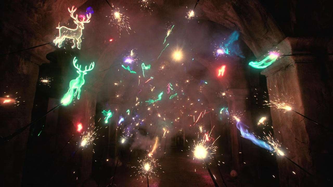 Colorful Harry Potter spells being cast in a dark chamber with glowing wand trails