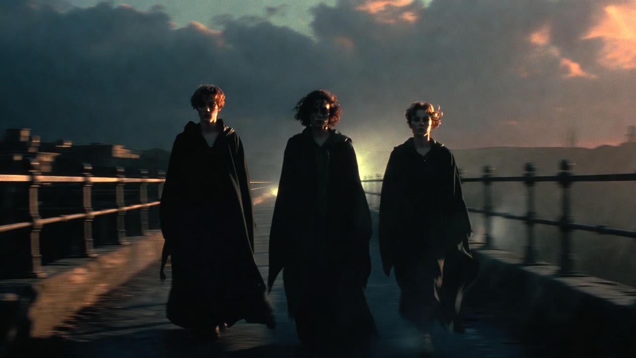 Dramatic cinematic silhouette of adult Harry, Ron, and Hermione at Hogwarts representing fan-made Cursed Child movie trailer concepts
