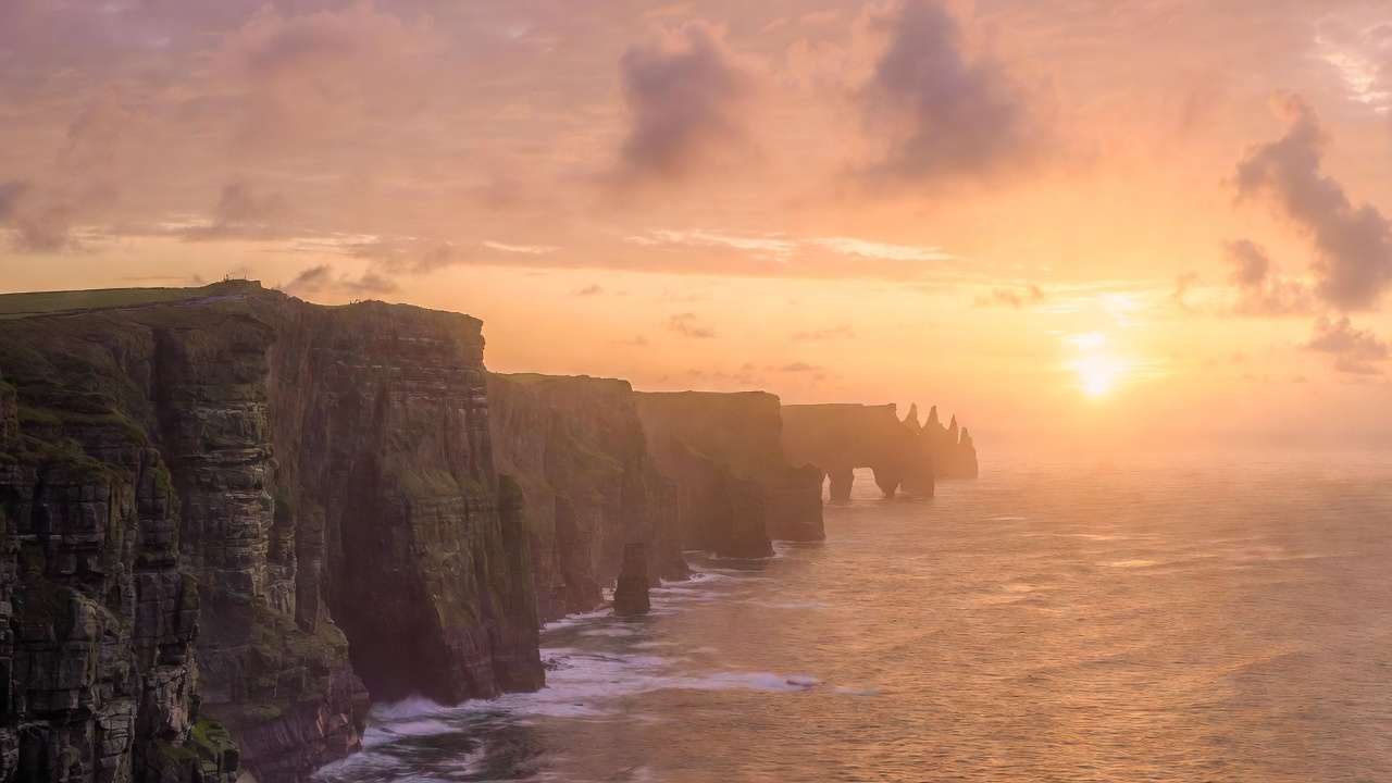 Magical golden sunset over the Cliffs of Moher Ireland stunning natural scenery