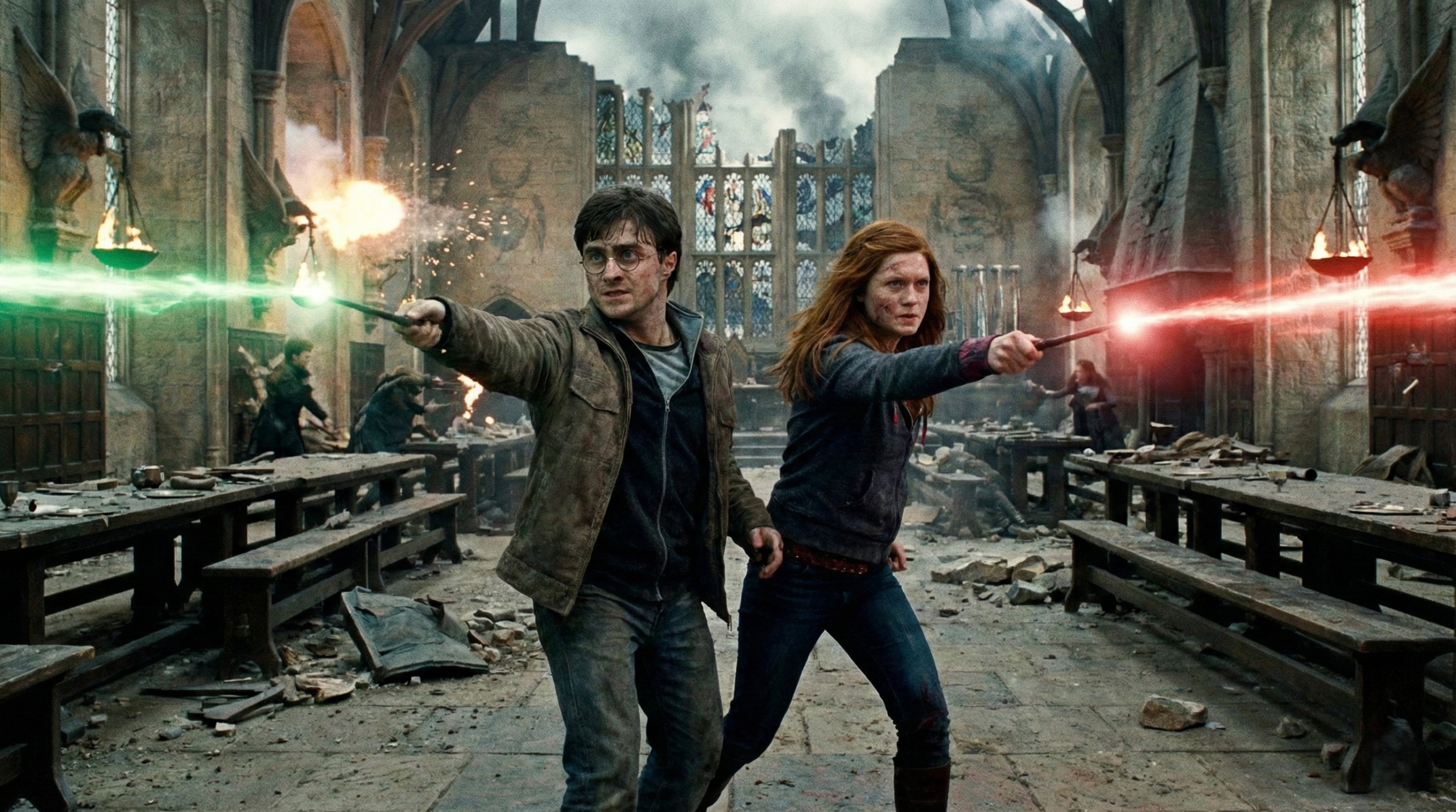 Harry and Ginny Weasley fighting together during the Battle of Hogwarts
