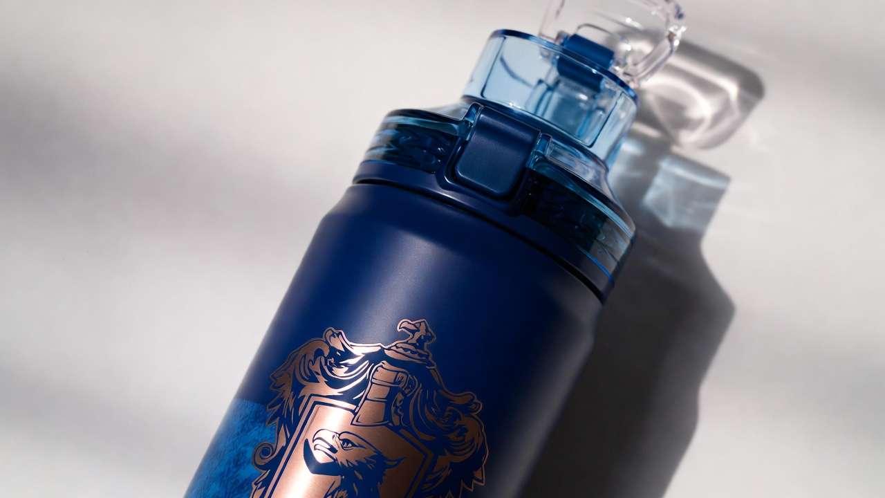 Ravenclaw Harry Potter Owala FreeSip bottle with blue eagle crest and bronze accents
