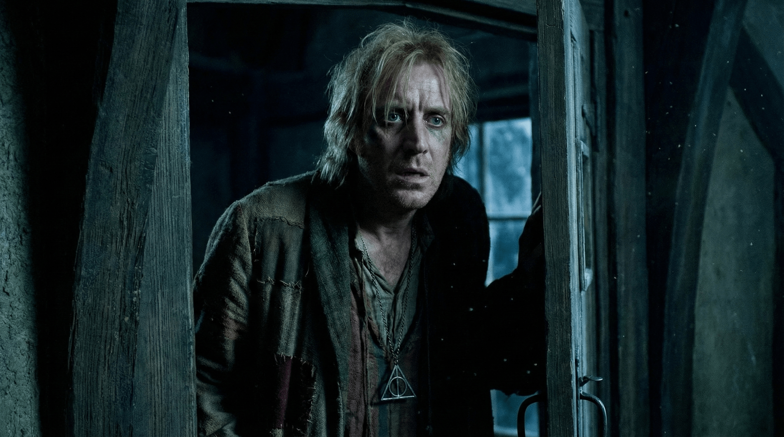 Xenophilius Lovegood in panicked moment during Death Eater threat scene in Harry Potter and the Deathly Hallows
