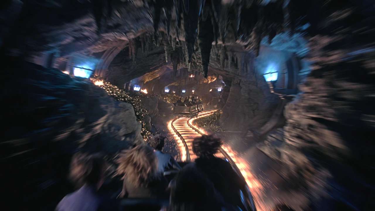 Mine cart chase scene with Harry, Ron, and Hermione inside Gringotts vaults during Escape from Gringotts ride