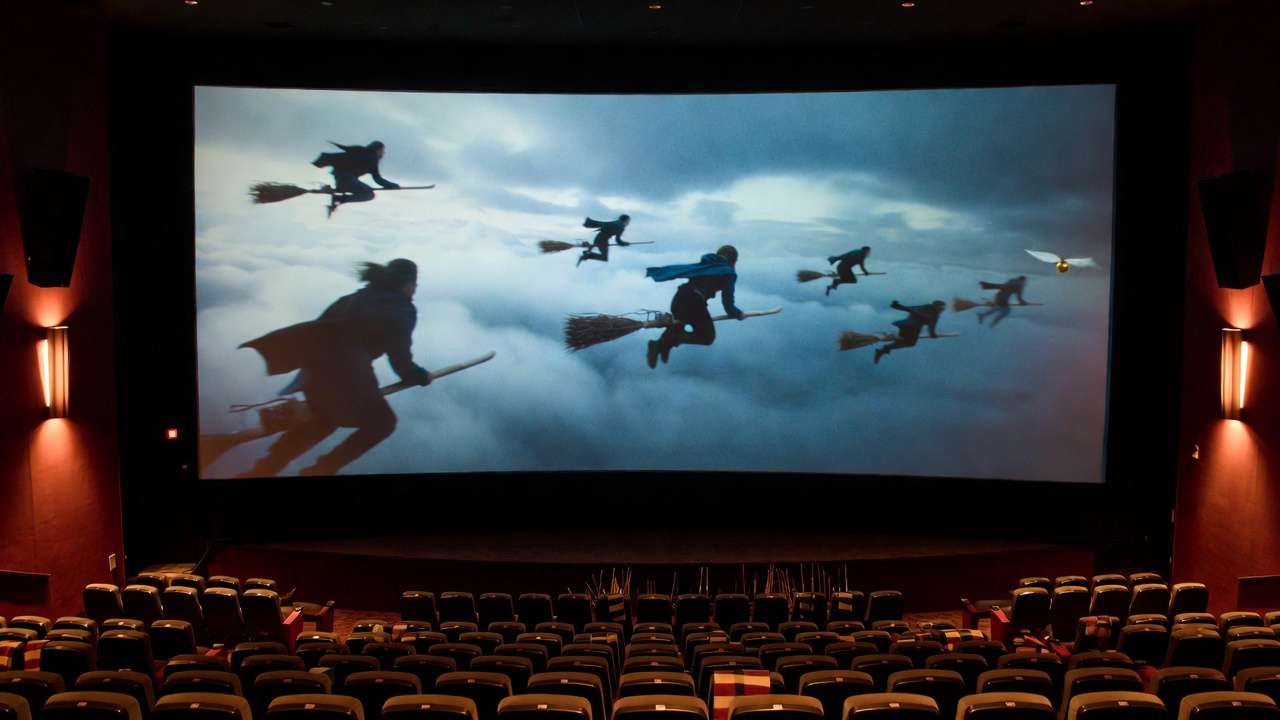 Immersive big-screen Quidditch scene during a Harry Potter movie marathon in theater