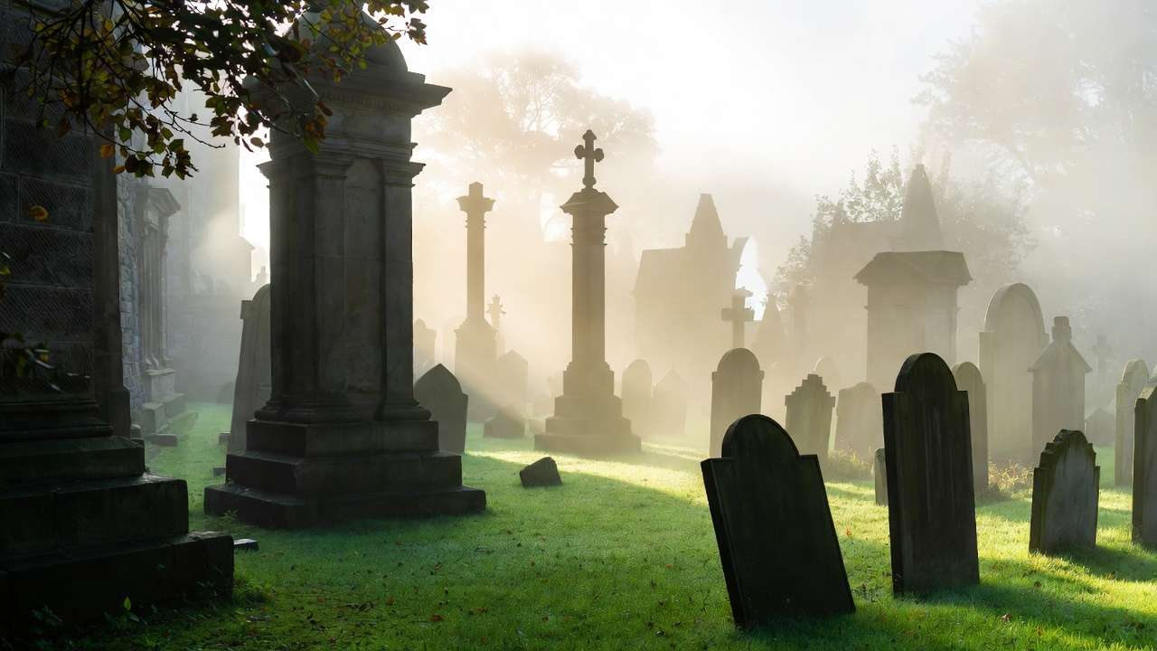 Misty gravestones in Greyfriars Kirkyard Edinburgh, inspiration for Harry Potter character names like Tom Riddle