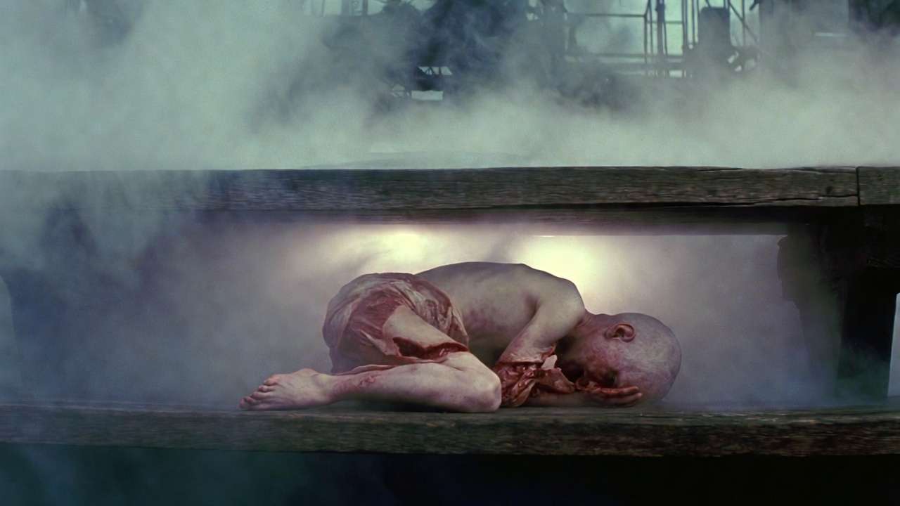 Maimed child representing Voldemort's damaged soul under bench in King's Cross limbo, Harry Potter Deathly Hallows