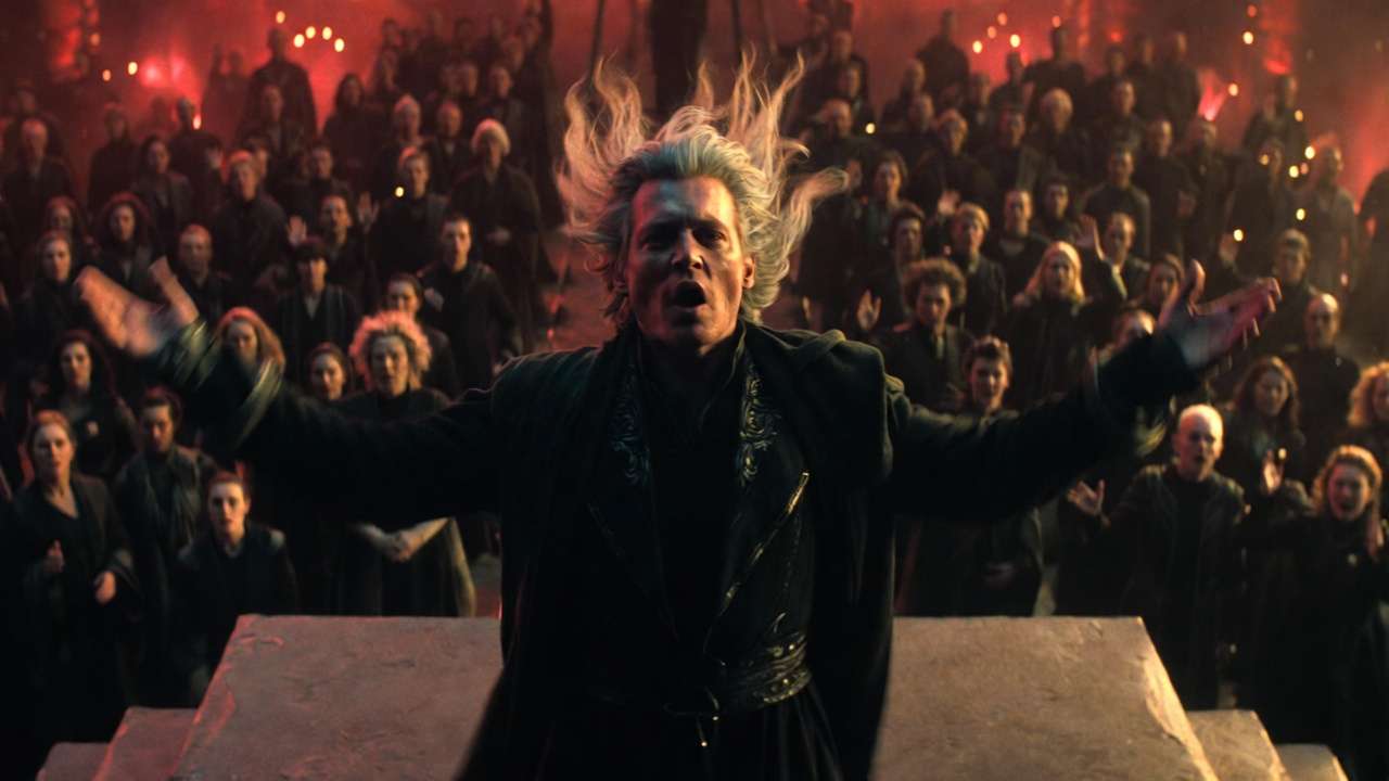 Johnny Depp as Grindelwald giving iconic rally speech in Fantastic Beasts: The Crimes of Grindelwald, dramatic crowd scene