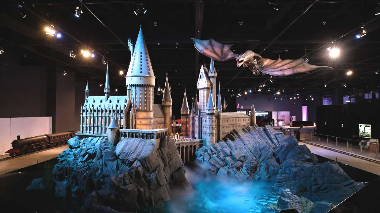 Immersive Hogwarts castle model with dragon at Harry Potter: The Exhibition NYC display
